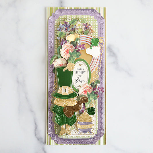 green and purple card with paper pieced leprechaun and pot of gold