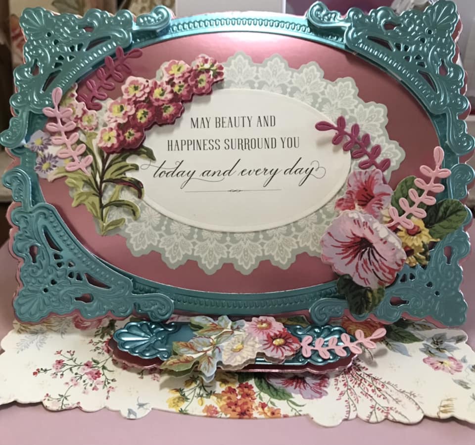 Pink and blue card with diecut sentiment and flowers