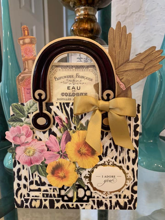 a picture frame with a bow on top of it.