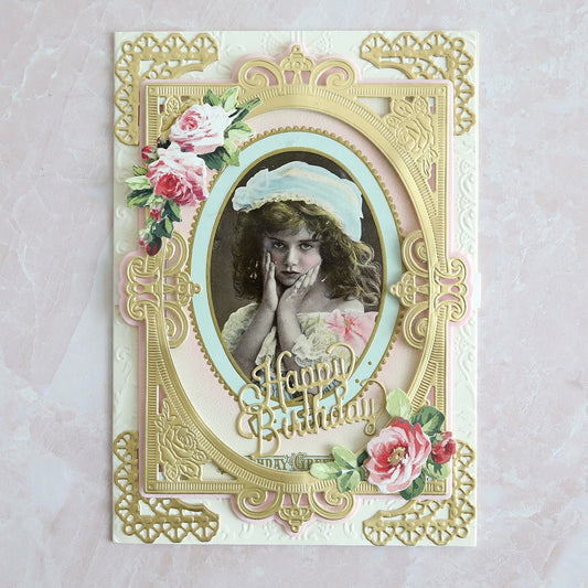 A birthday card with a little girl in an ornate frame.