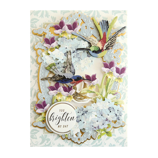 Blue card with blue and purple flowers and hummingbird stickers
