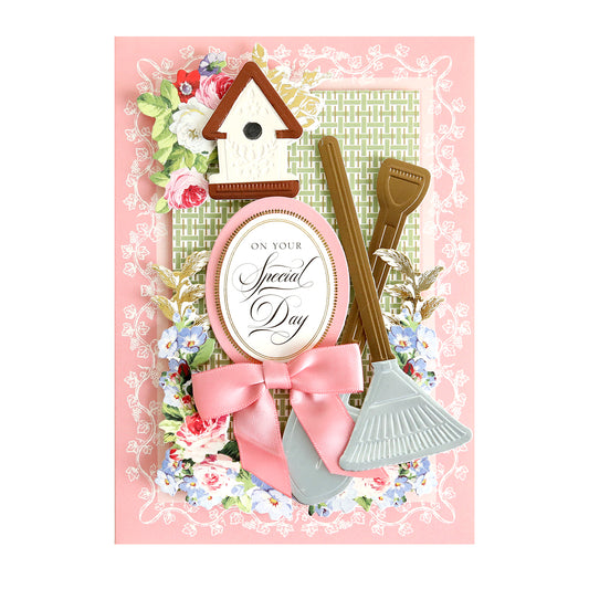 shovel and rake icons on a pink card with bird house