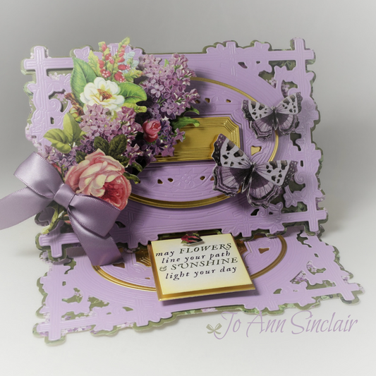 Purple easel card with pink, white and pink flowers.
