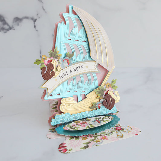 Phoebe, gold and blue schooner with vellum sail card