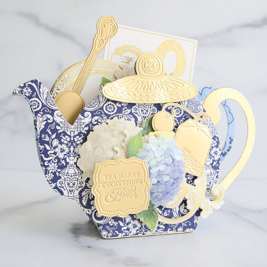 Canton Bleu teapot box filled with antique card, hydrangeas and gold accents.