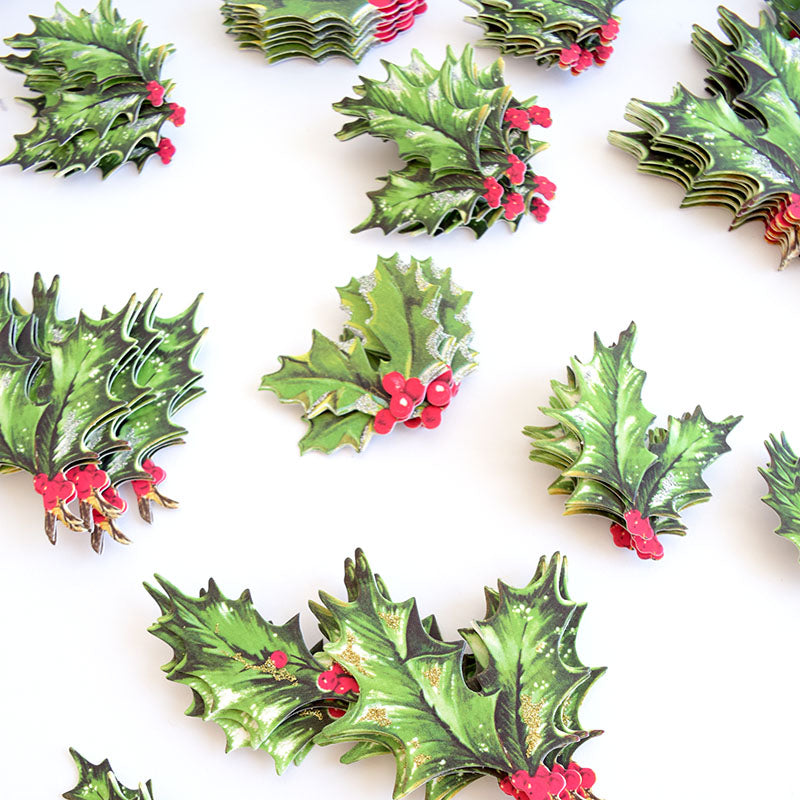 The Retro Holly Sticker Bundle is arranged on a white surface in a storage folio.