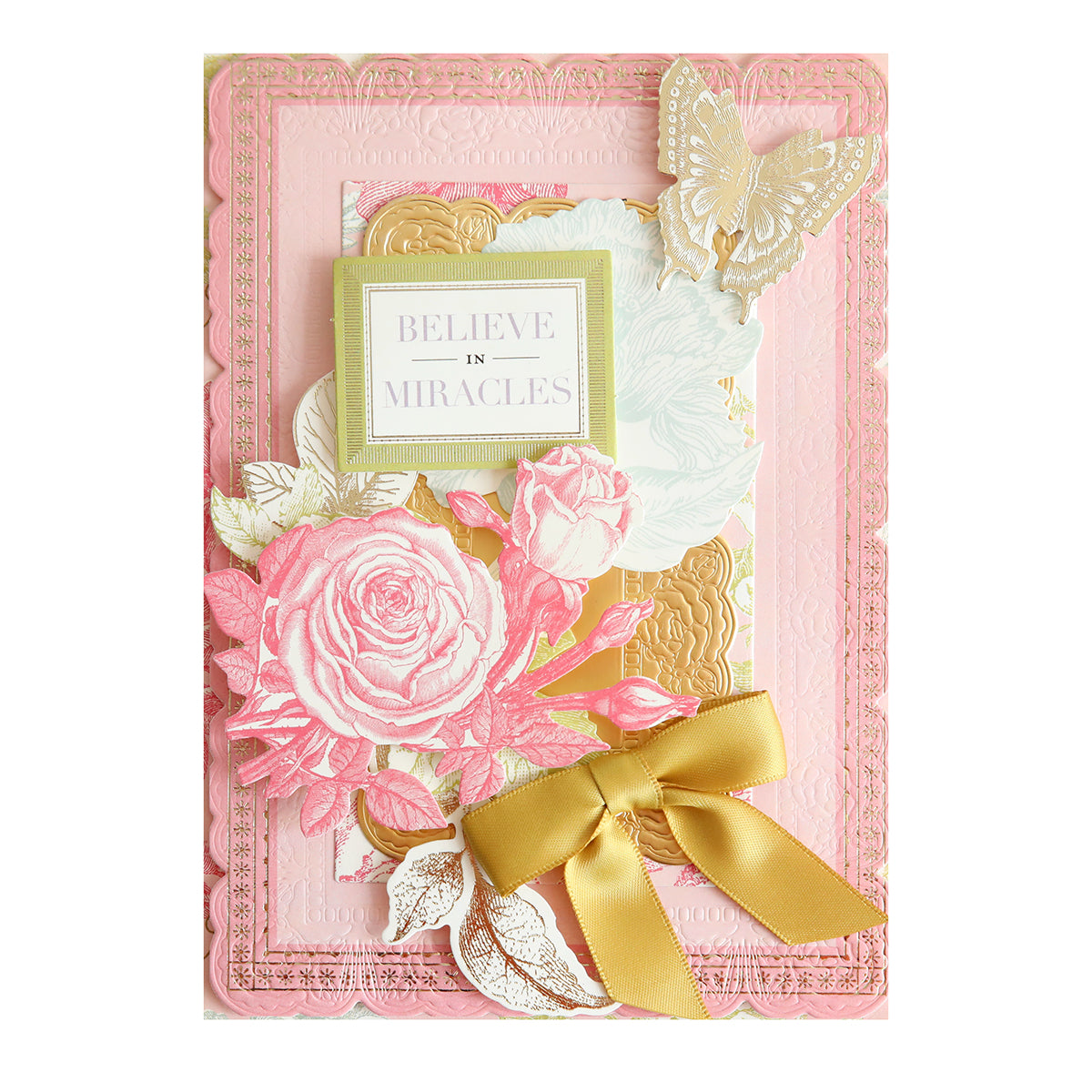The Ultimate Vintage Botanical Papercrafting Collection includes a decorative card with pink roses, gold accents, a butterfly, a gold ribbon, and a "Believe in Miracles" sign on an embossed pink background.