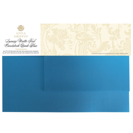 A package of Luxury Matte Foil Cardstock Dark Blue, ideal for embossing or diecutting, includes a decorative label and two sheets of elegant dark blue cardstock.