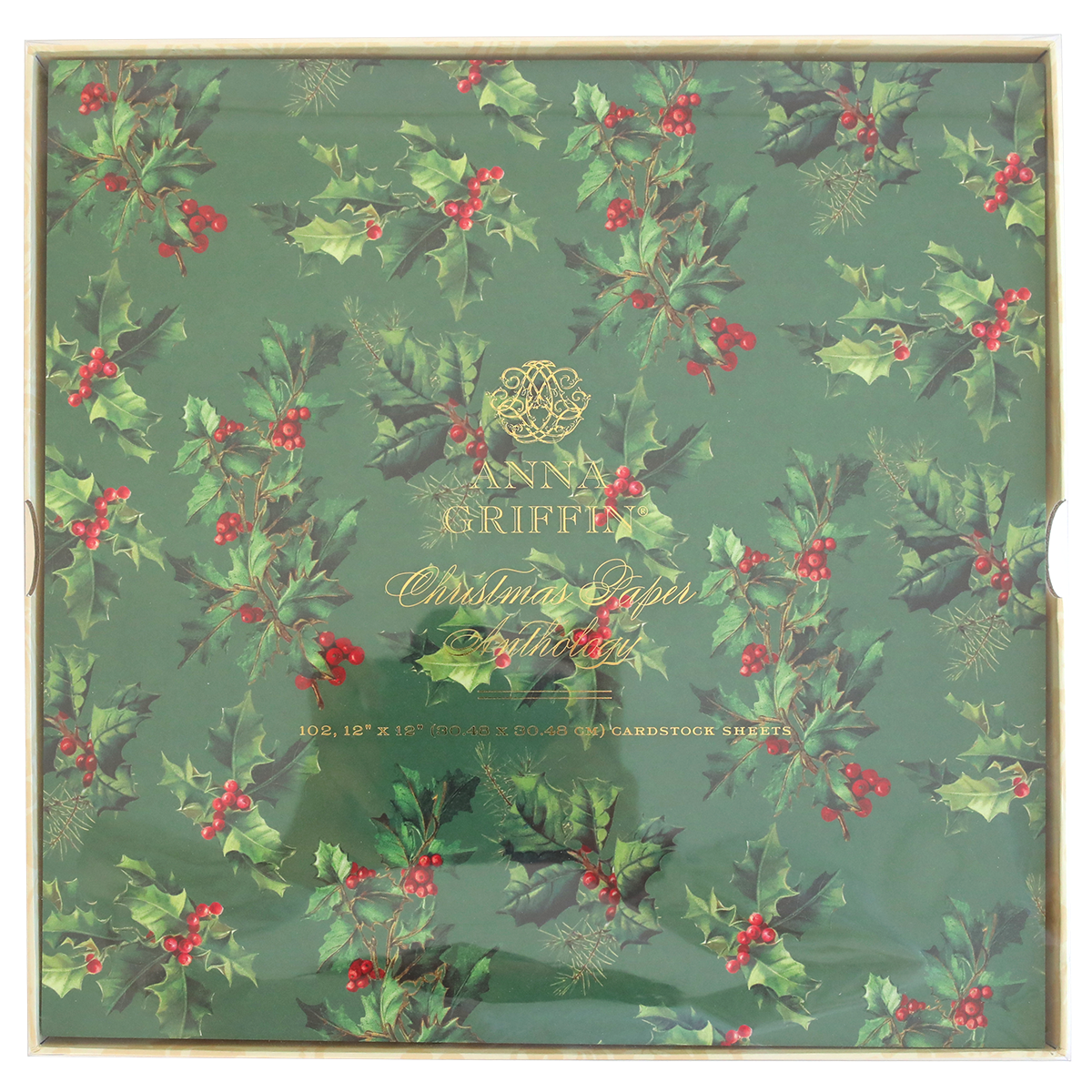 The Christmas Paper Anthology includes cardstock adorned with festive patterns, featuring a holly design with red berries on a green background, ideal for crafting handmade holiday tags.
