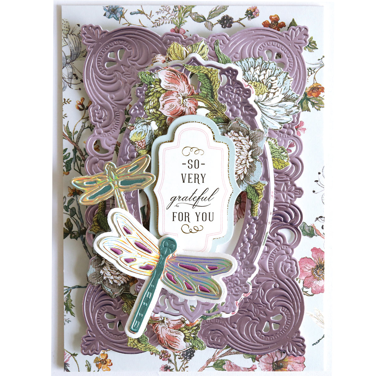 Handmade greeting card featuring embossed purple frames, floral designs, and two dragonflies made with Dragonfly and Butterfly 3D Dies, plus the message "So very grateful for you." Ideal for decorative creations.