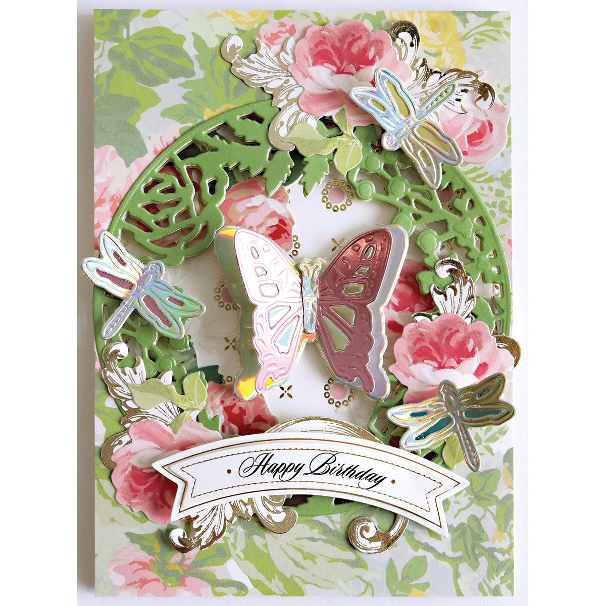 A decorative birthday card with pink flowers, green foliage, and butterflies features a “Happy Birthday” banner—perfect for showcasing handmade creations with Dragonfly and Butterfly 3D Dies.