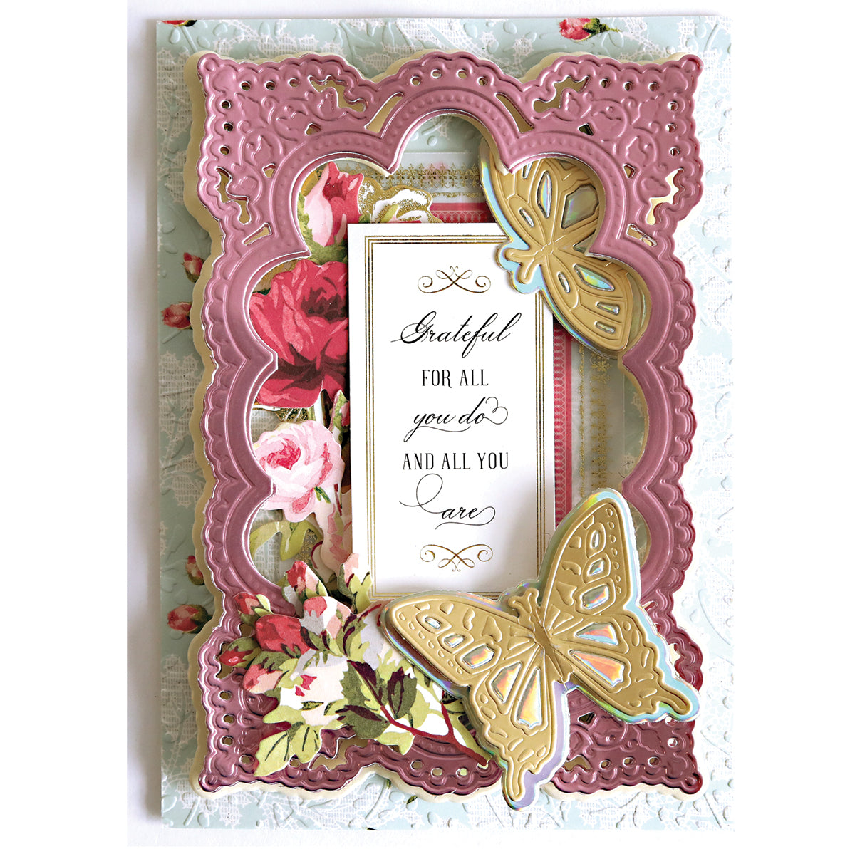 Decorative greeting card with a floral background, ornate pink frame, gold butterflies made using the Dragonfly and Butterfly 3D Dies, and the message "Grateful for all you do and all you are." Ideal for fans of handmade creations.