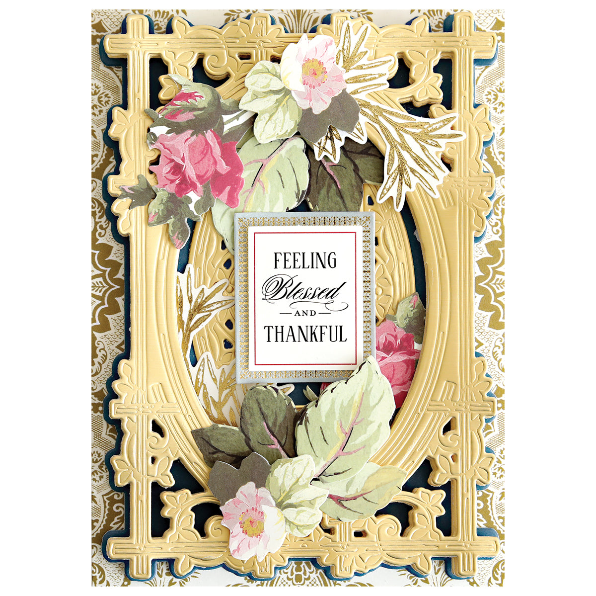 An ornate, gold-embossed card with pink and white flowers features "Feeling Blessed and Thankful"—ideal inspiration for handmade projects or card making using the Woodland 3D Concentric Frame Dies.