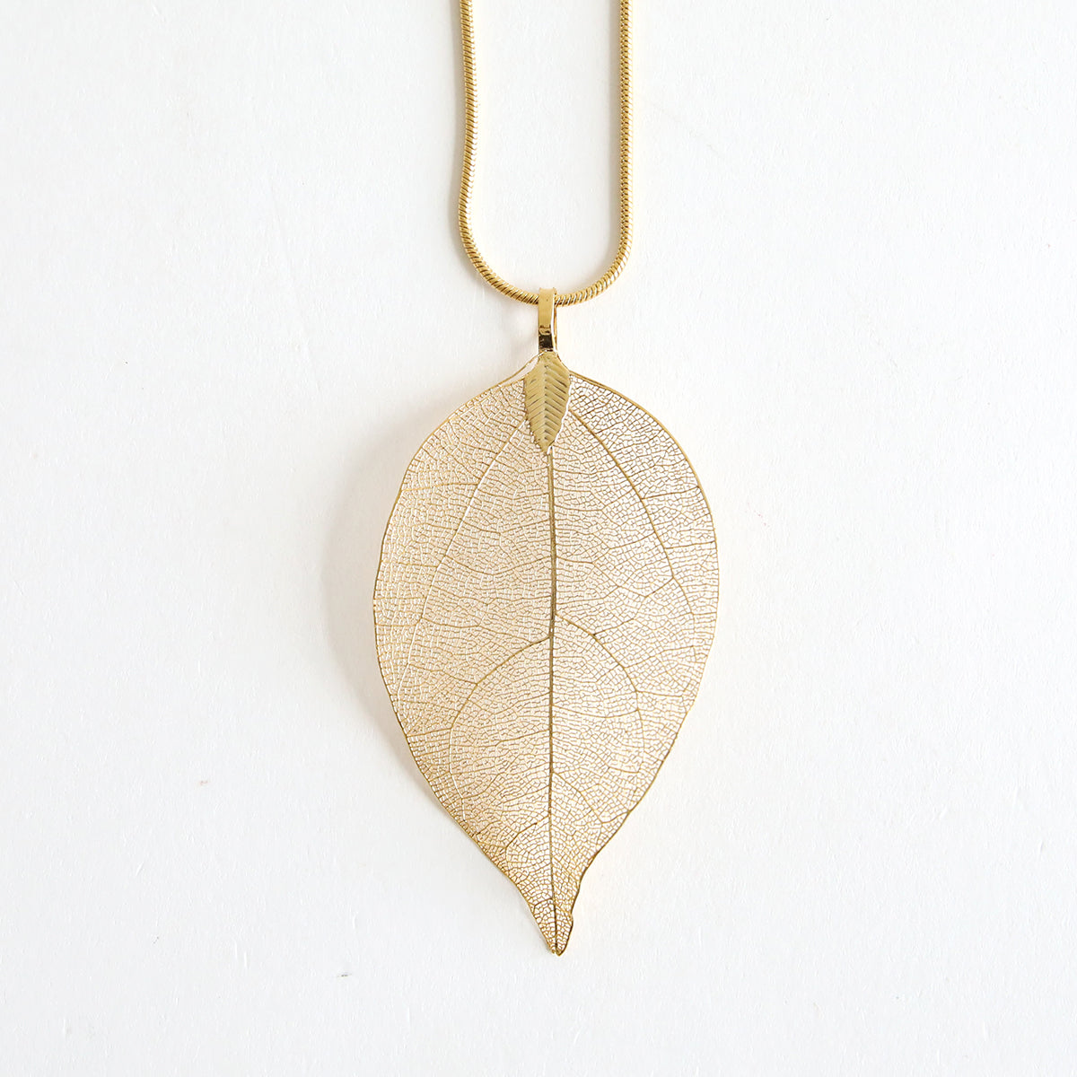 Two elegant gold necklaces from the "Set of 2 Gold Necklaces Kit" feature a delicate leaf-shaped pendant on a slender chain, beautifully displayed against a plain white background.