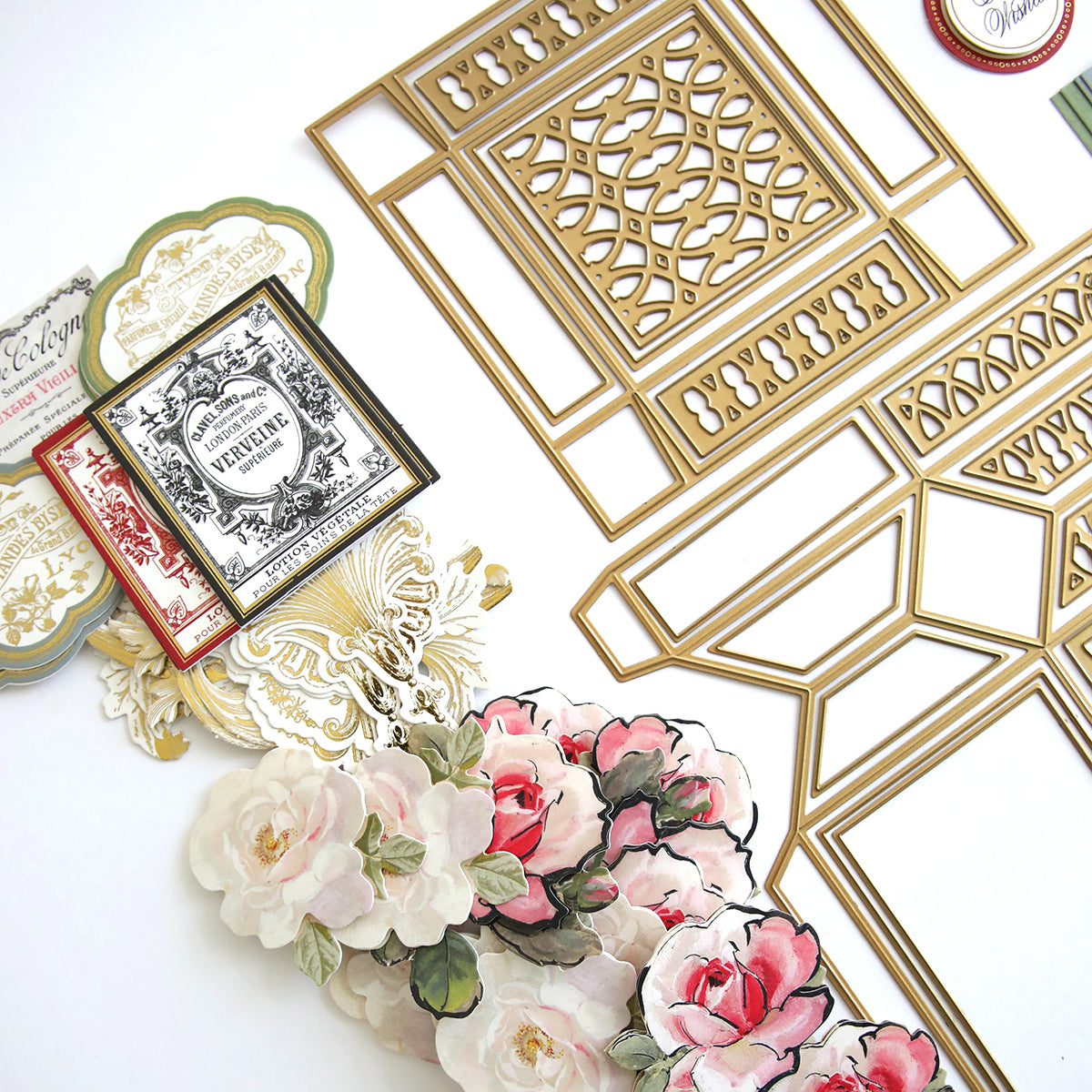 A gift-wrapped Perfume Box Class Materials and Dies with flowers on them.