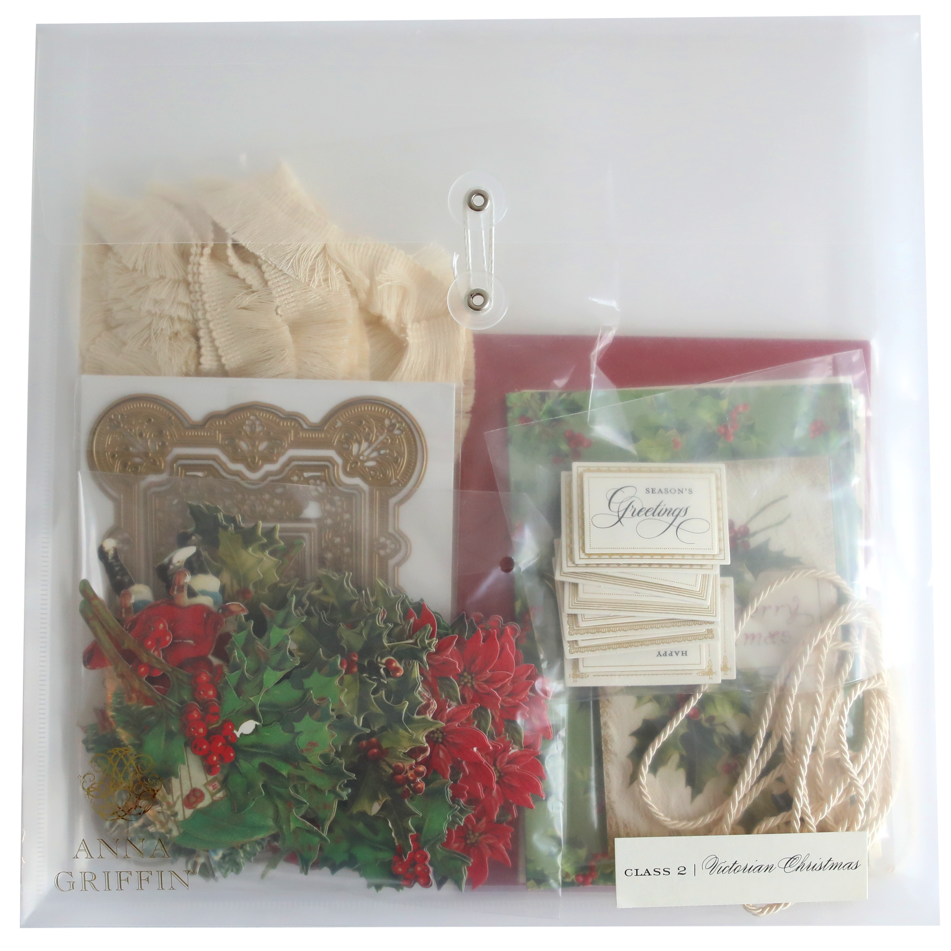 A clear plastic bag with holly, ribbon and Victorian Christmas Class Materials and Dies.