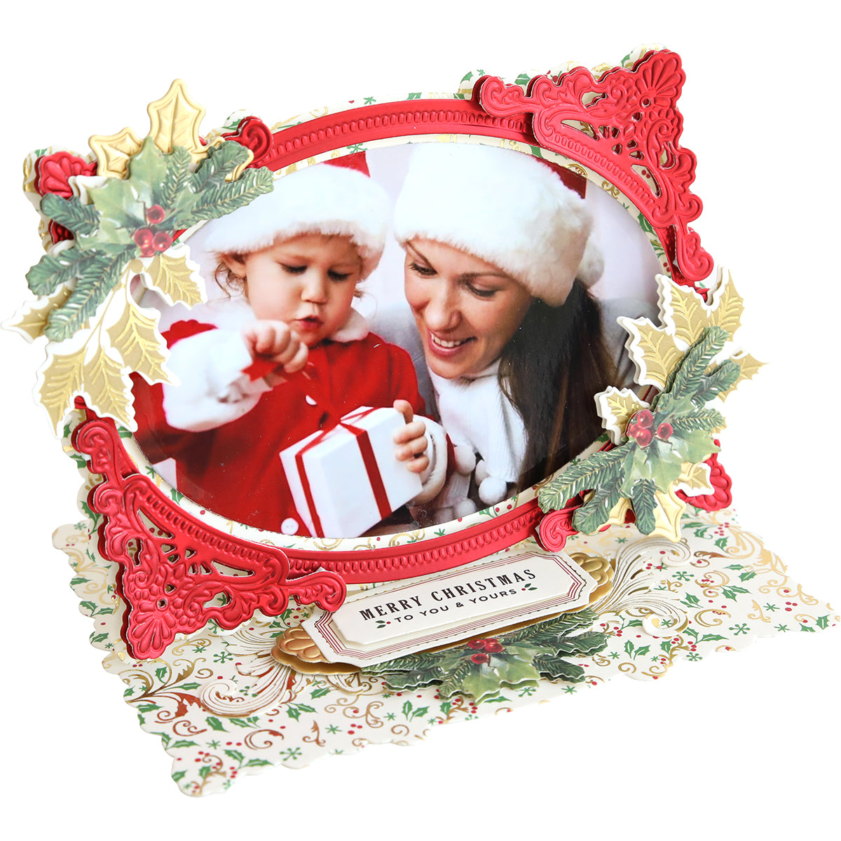 A family photo with holly leaves and a child in a hat, displayed on an Anna Griffin Photo Finish Easel Card Dies.