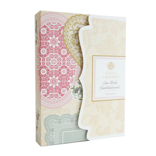 A pink and white box adorned with Lace Doily Embellishments.