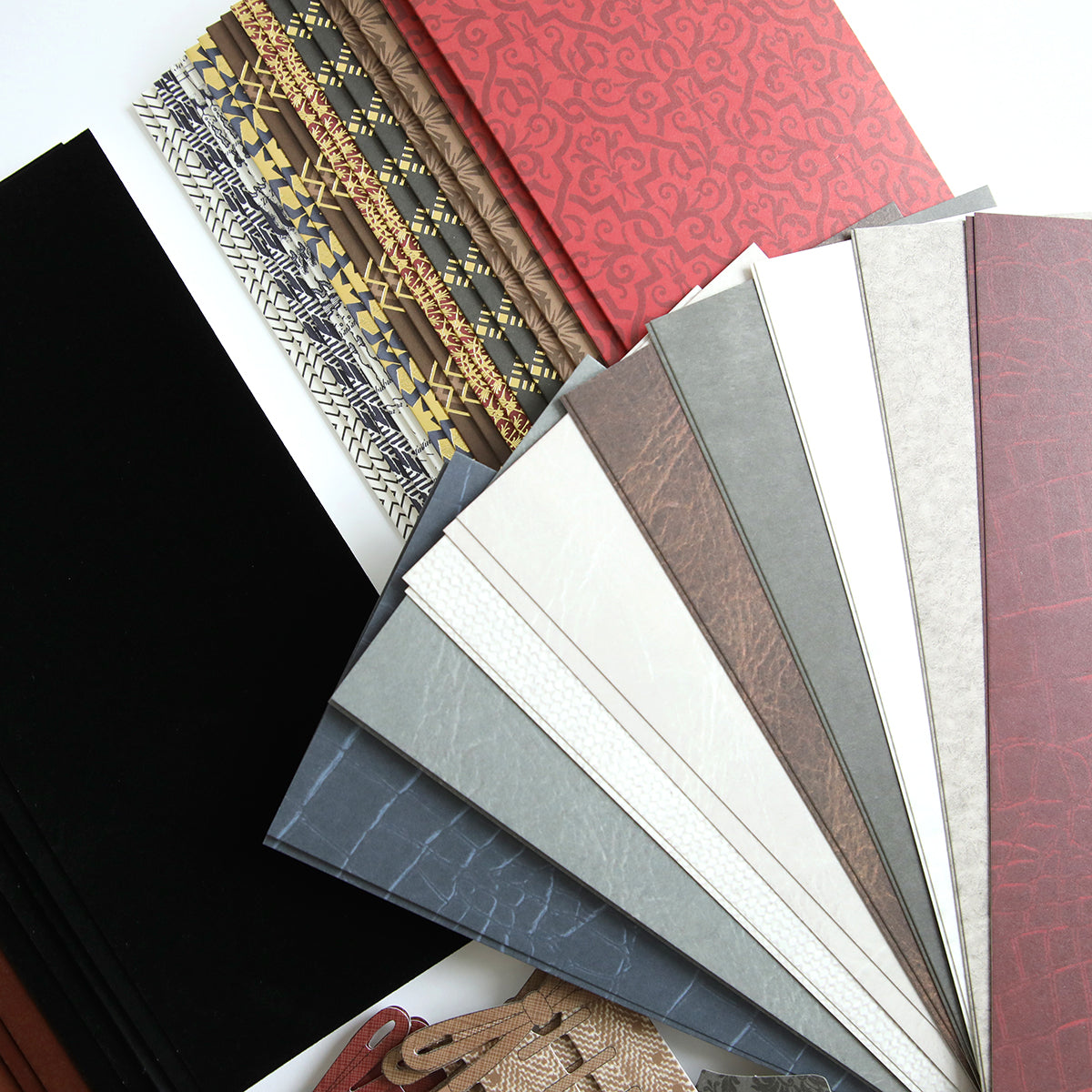 Samples of Paper Wingtips Refill Kit in various colors, patterns, and textures are displayed on a white background. The swatches range from neutral tones to vibrant colors and intricate designs, enhanced by 3D embellishments that bring the variety of textures to life.