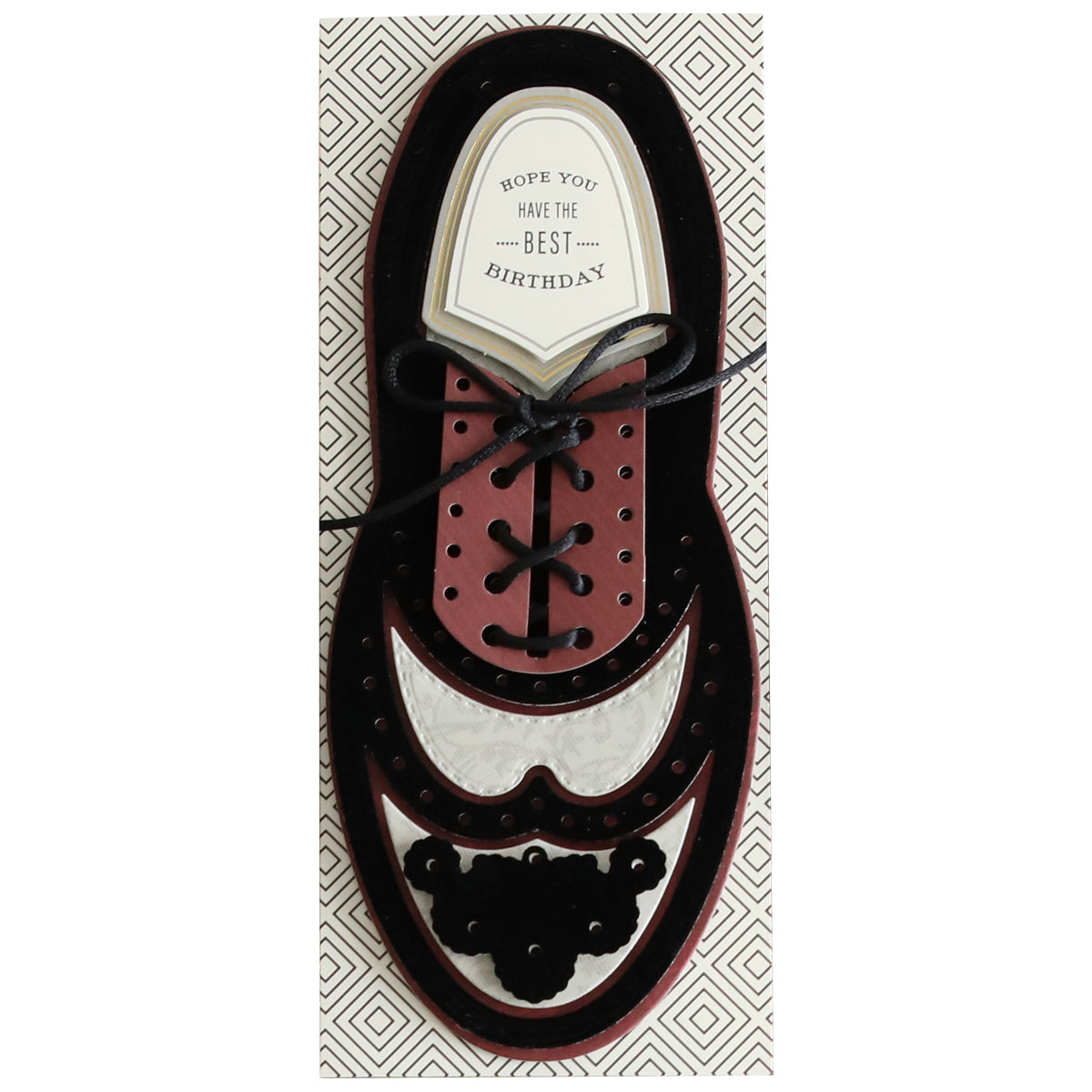 A **Paper Wingtips Refill Kit** shaped like a formal shoe with laces, featuring the message "Hope you have the best birthday" on the tongue of the shoe. The cardstock layers and 3D embellishments give it a refined touch, while the background boasts a geometric pattern.