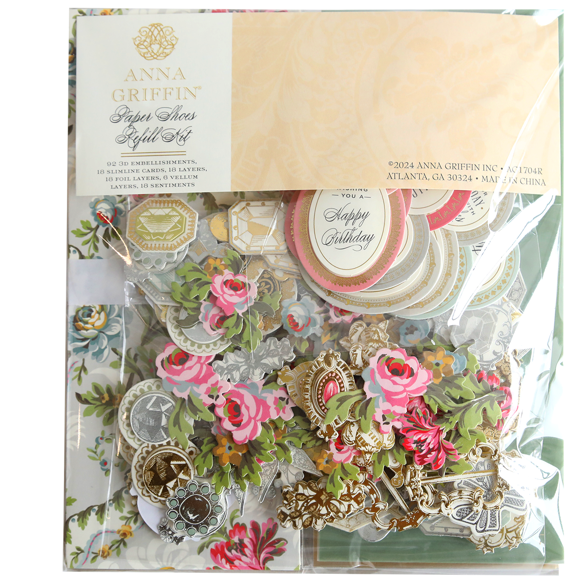 A package containing a variety of flowers and Paper Shoes Finishing School Refill Kit.