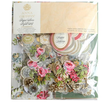 A package containing a variety of flowers and Paper Shoes Finishing School Refill Kit.
