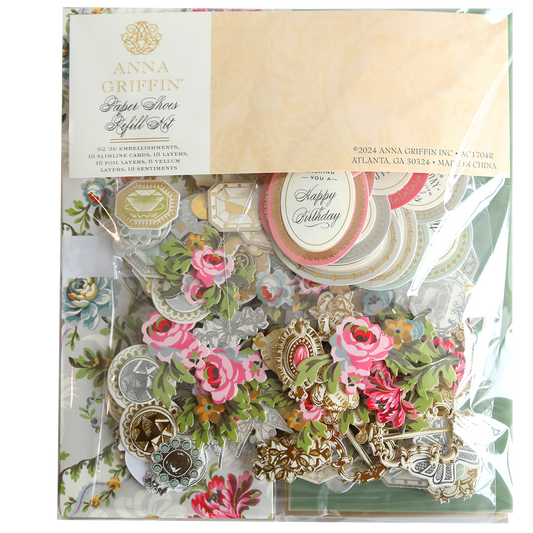 A package containing a variety of flowers and Paper Shoes Finishing School Refill Kit.