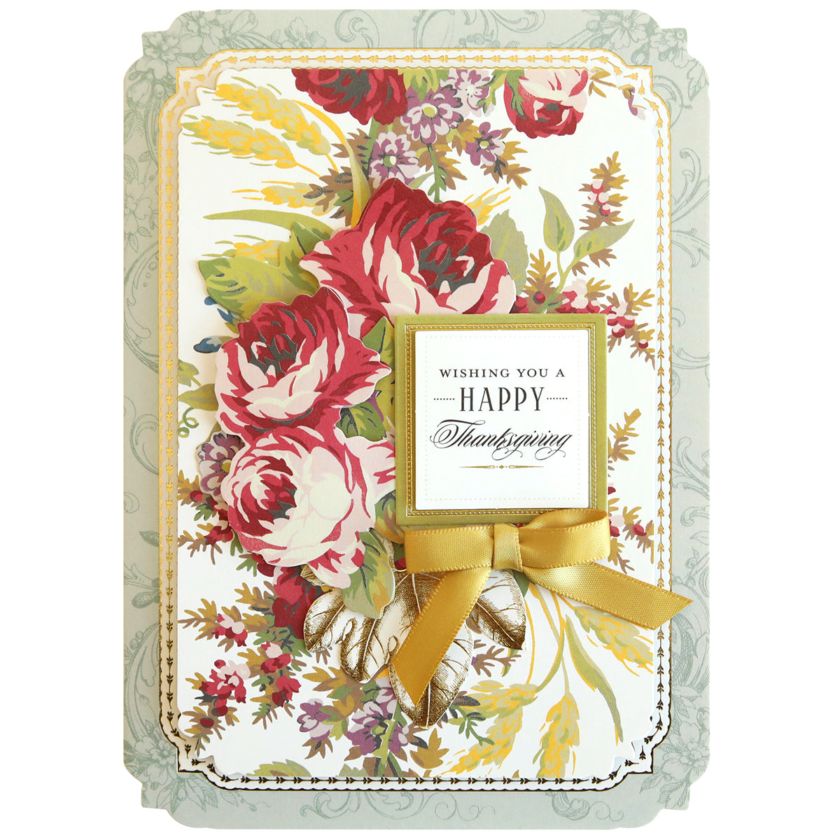 The Simply Thanksgiving Card Making Kit allows you to create a beautiful Thanksgiving card featuring red and pink flowers with green leaves, a golden ribbon, and an elegant border. The handmade card reads "Wishing you a Happy Thanksgiving" in a decorative font, making it perfect for crafting enthusiasts looking to add a personal touch to their greetings.