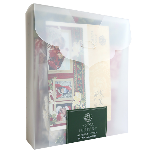 A translucent plastic folder with a scalloped flap holds the Simply Noel Mini Album and Materials, partially visible through the frosted cover.