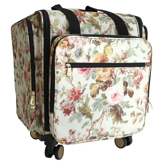 The Francesca Rolling Craft Luggage features a floral print, multiple zippered compartments, black handles, and four wheels—an ideal stylish rolling organizer for travel.