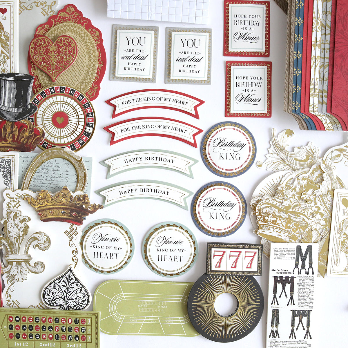 The Simply King of My Heart Card Making Kit features vintage-style handmade cards, decorative labels, crowns, patterned papers, and 3D embellishments—perfectly arranged for unique card creations.