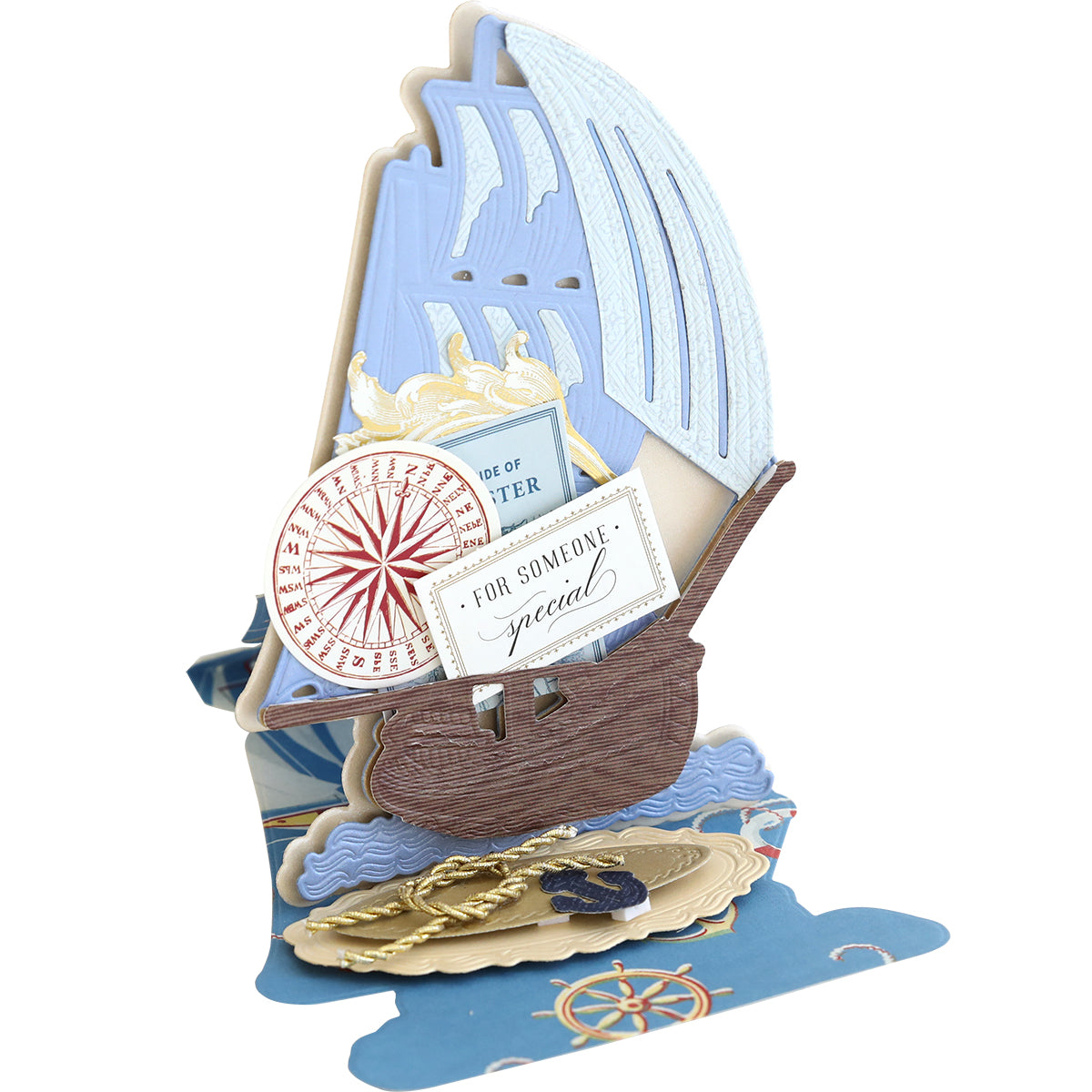 Pop-up card with a sailboat featuring blue sails, a compass design, and "For Someone Special" message. Crafted using Schooner Easel Dies to highlight waves and nautical elements celebrating mariners.
