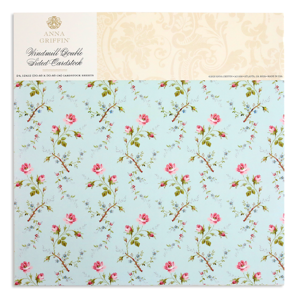 A light blue cardstock cover showcases a pattern of pink roses and green stems, with "Anna Griffin, Windmill 12x12 Cardstock" on top. Ideal for elegant designs using the Windmill Easel Dies.