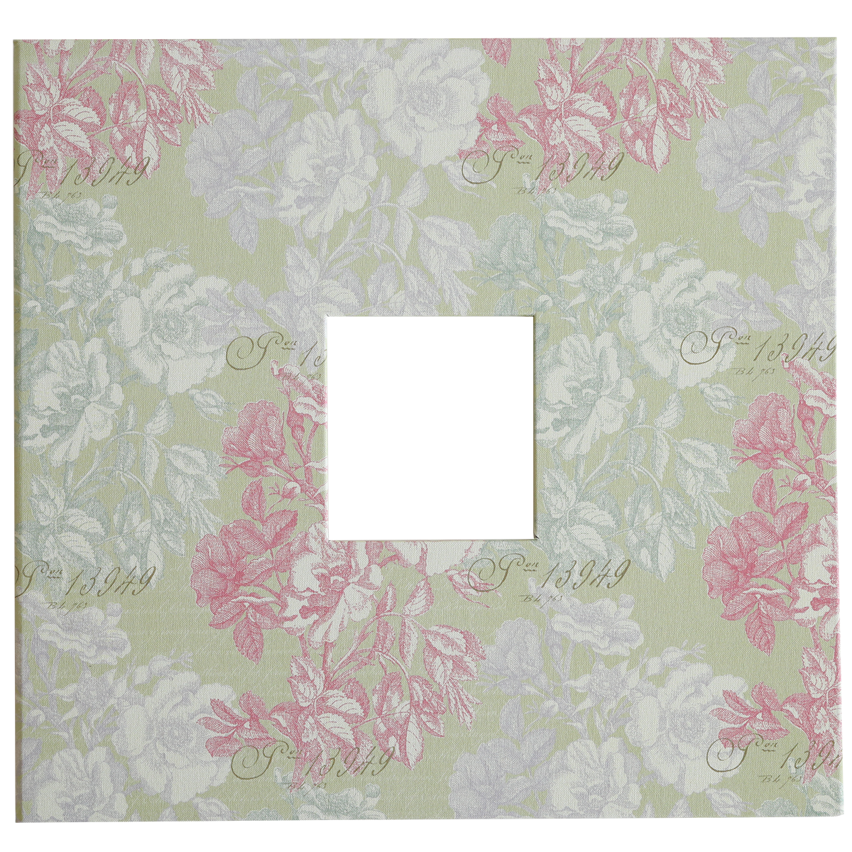 A square cut-out is centered on the pale green patterned cover of the Antique Botanical Scrapbook Album, featuring pink and white floral motifs and faint script text in the background.