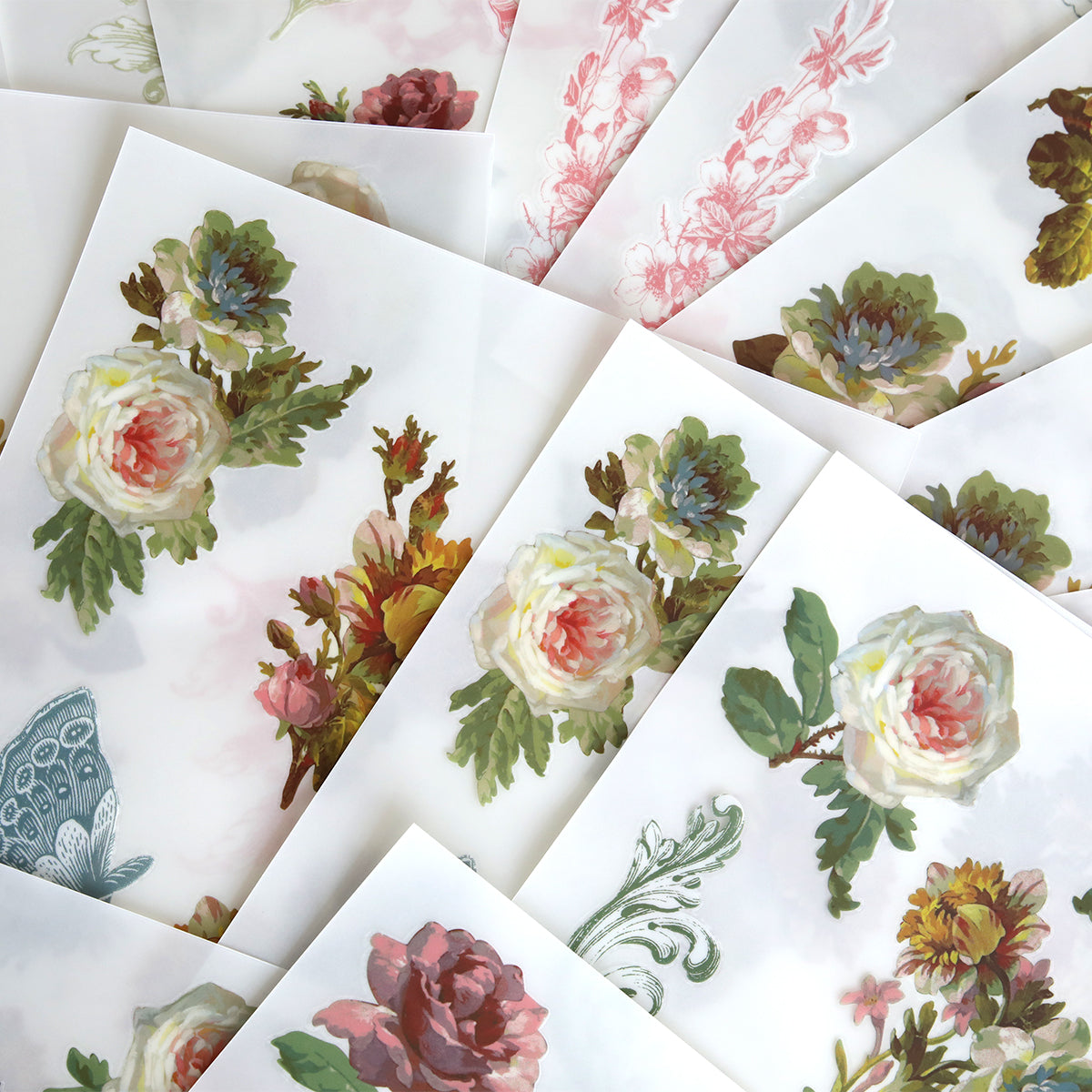 Francesca Rub On Transfers feature sheets with floral watercolor designs, like roses and leaves, overlapped beautifully—ideal for embellishing scrapbook pages or adding artistic touches to any project.