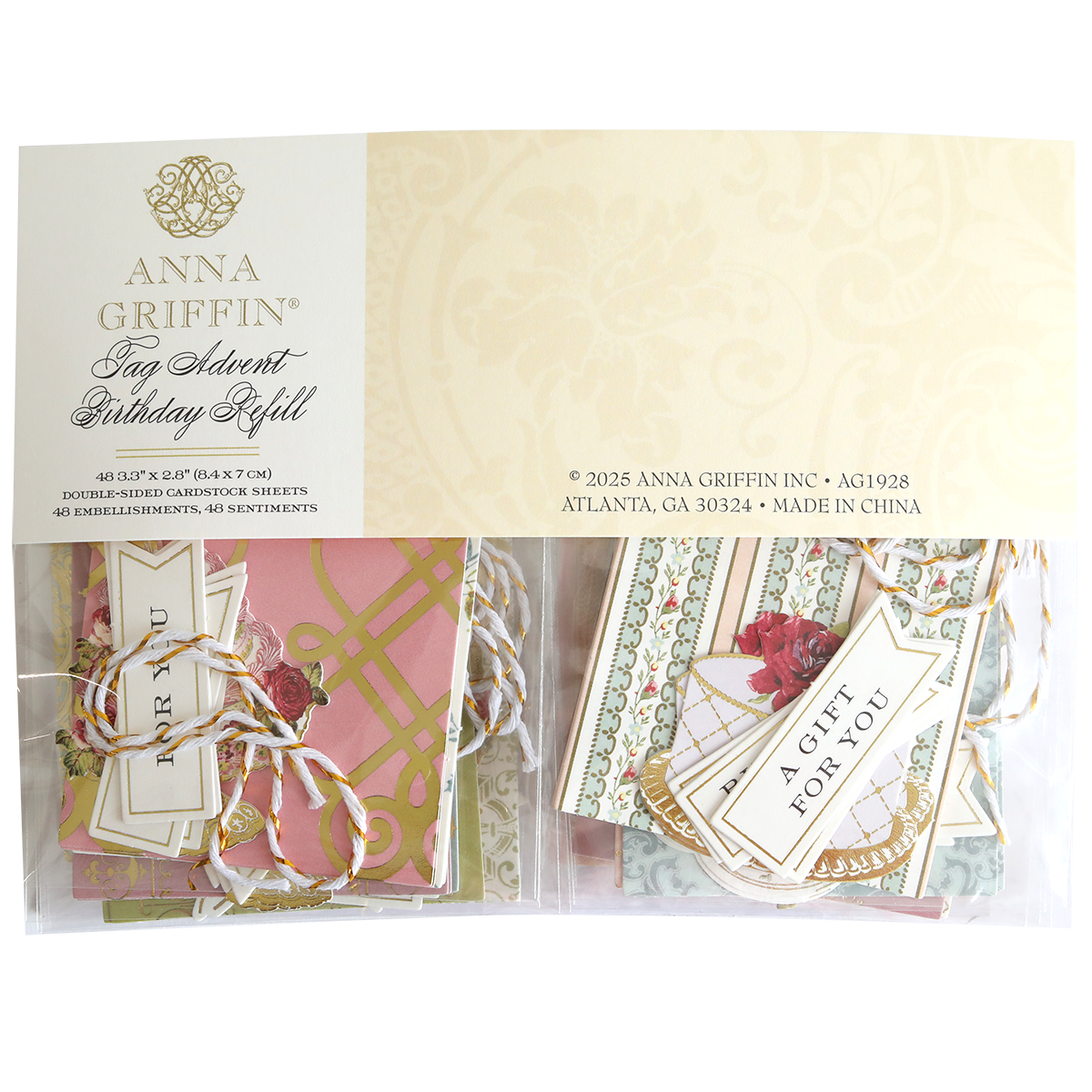 A package of Tag Advent Birthday Refill, featuring assorted cardstocks, scrapbook tags, and pink and cream embellishments—ideal for card making and DIY crafts.