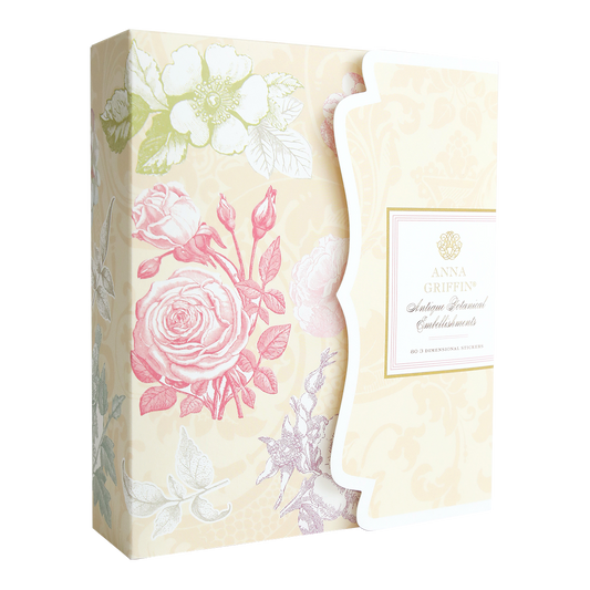 The Antique Botanical Embellishments box from the Francesca collection features pastel floral designs, a scalloped right edge, and an "Anna Griffin" label—perfect for storing your floral stickers or 3D embellishments.