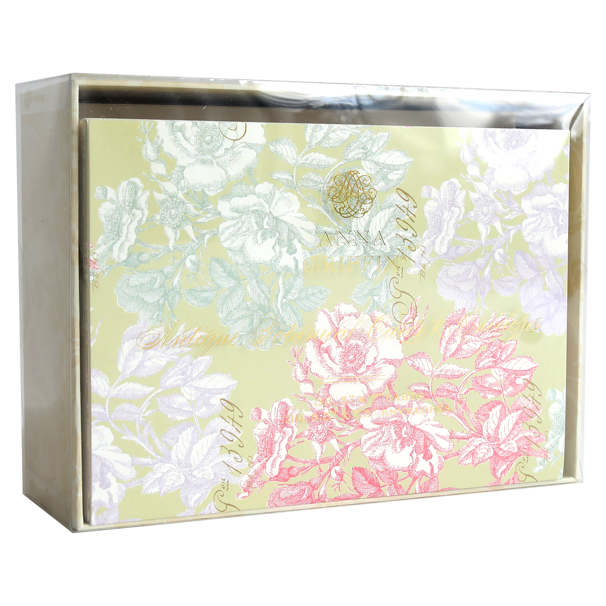 A box of Antique Botanical Cards and Envelopes, wrapped in clear plastic and featuring beautiful pink, white, and purple floral patterns on a pale yellow background inspired by vintage botanical cards.