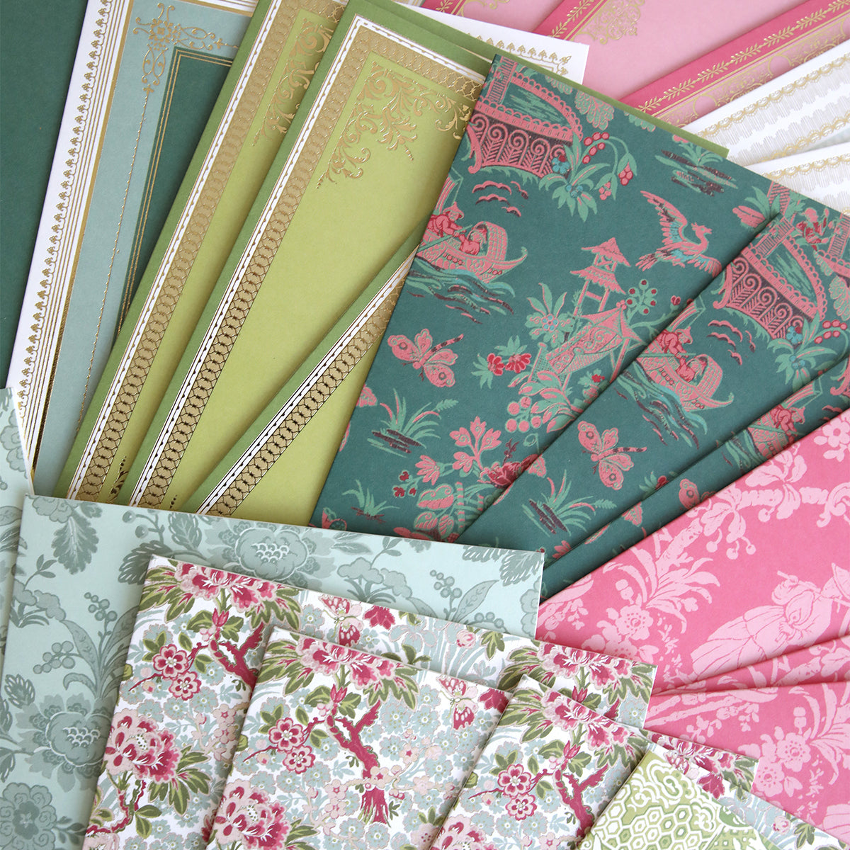 Lian Cards and Envelopes features decorative papers with stunning green, pink, blue, and gold patterns, beautifully displayed in an overlapping fan arrangement.