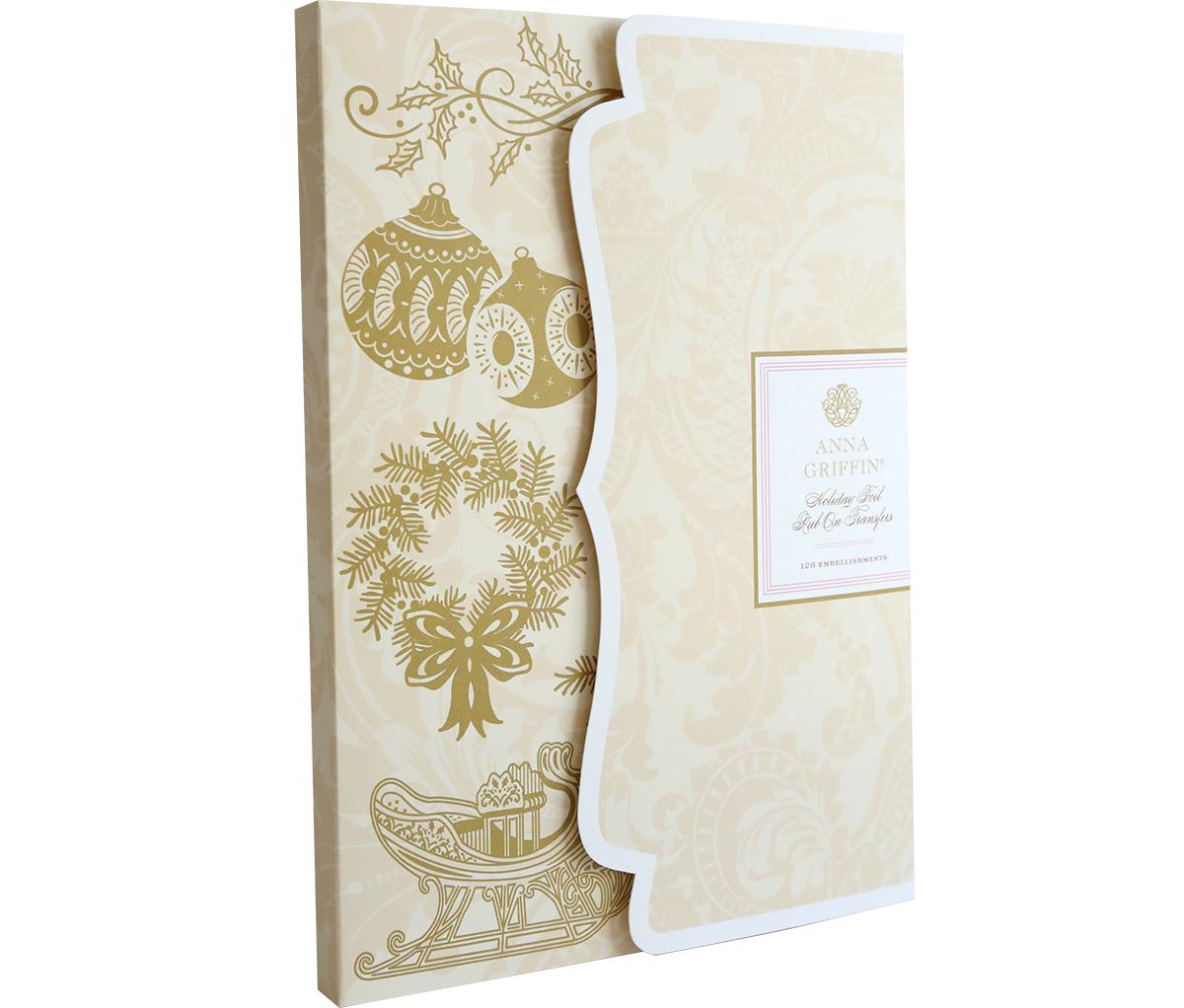 Pair the “Holiday Foil Rub On Transfers” with a beige and gold holiday card featuring ornaments, holly, and a sleigh for an elegant touch to your festive crafts.