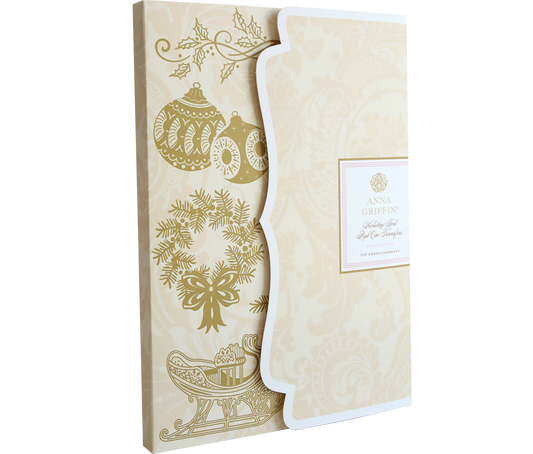Pair the “Holiday Foil Rub On Transfers” with a beige and gold holiday card featuring ornaments, holly, and a sleigh for an elegant touch to your festive crafts.