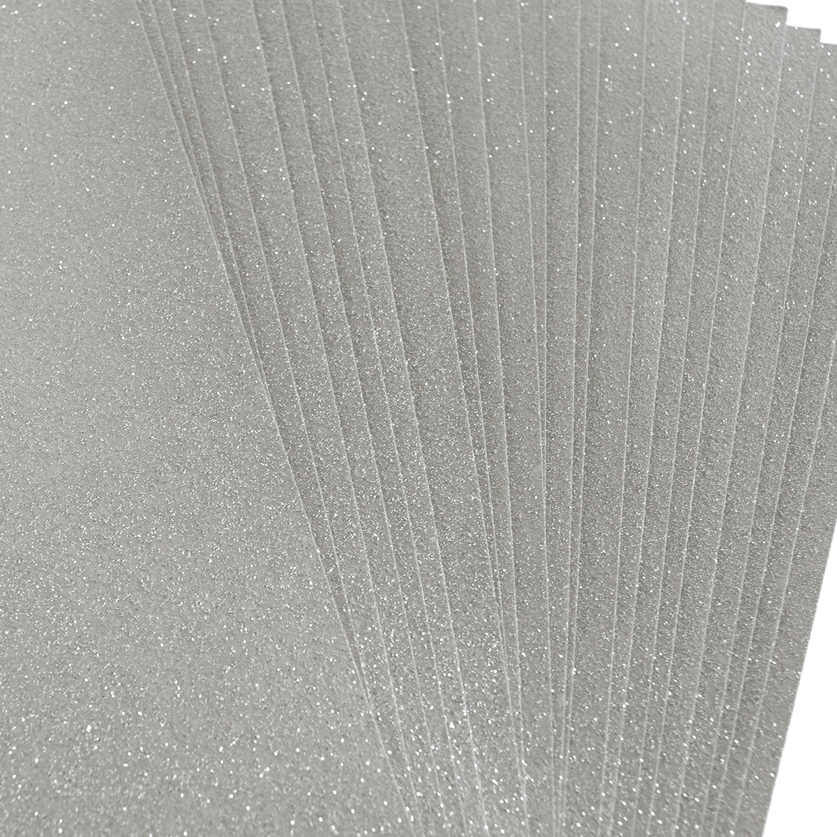A stack of silver glitter paper on a white background.