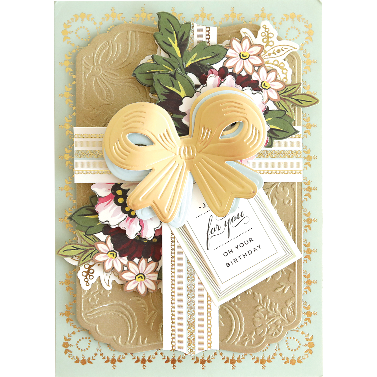 Create a stunning birthday card with Bow Cut & Emboss Folders—features embossed gold, paper bows, floral accents, and a "for you on your birthday" tag. Perfect for adding handmade flair to your next craft project!.