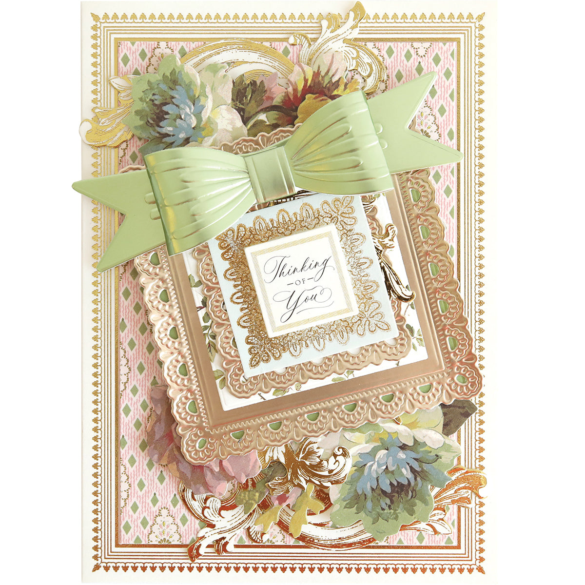 Create an ornate greeting card with Bow Cut & Emboss Folders, featuring gold detailing, pastel flowers, a large mint green bow, and “Thinking of You” in elegant script—a perfect handmade project.