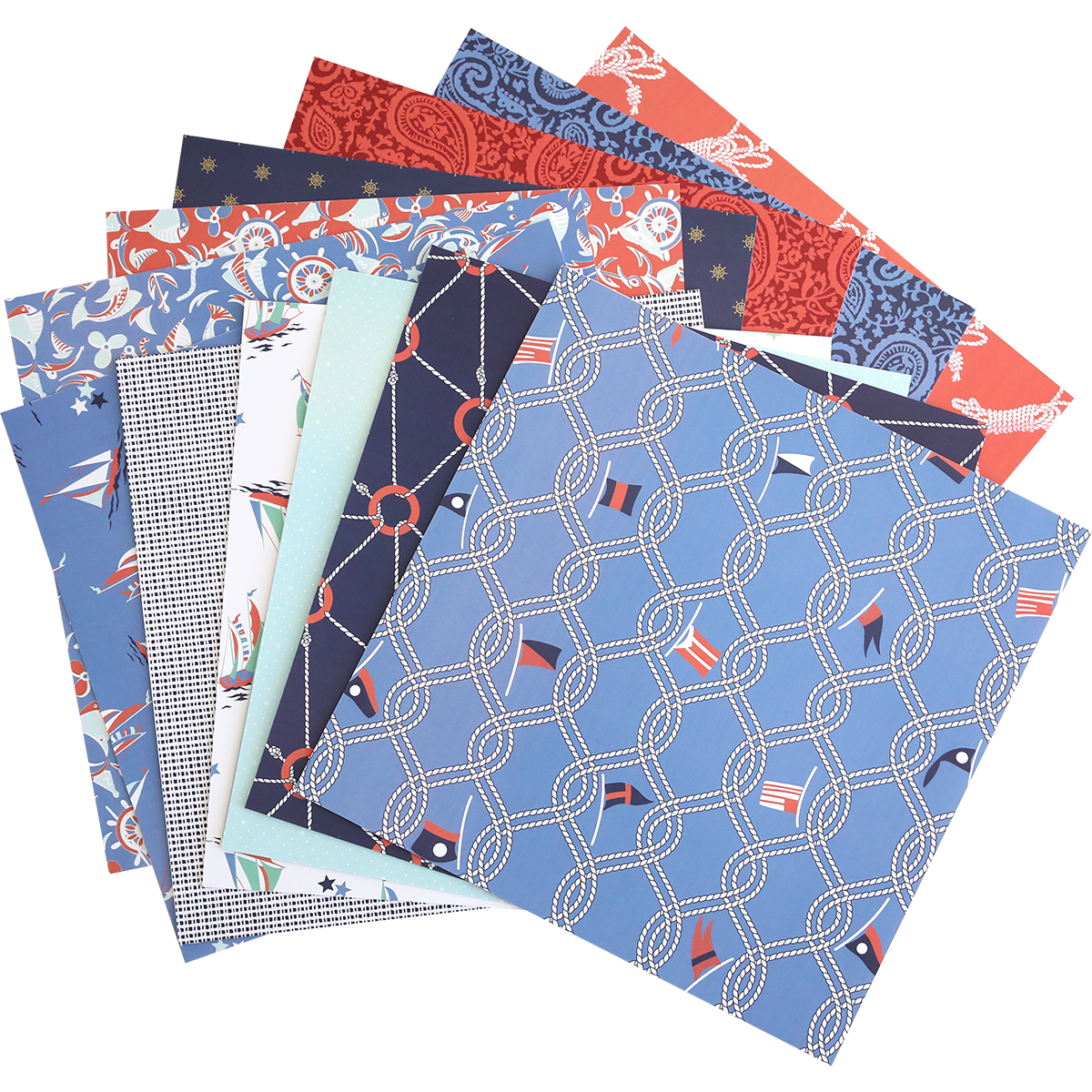 A stack of Lighthouse 12x12 Cardstock sheets with coastal nautical and geometric designs in blue, red, white, and navy tones is fanned out on a white background.