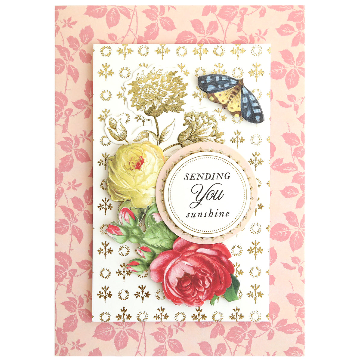 The In the Garden Card Making Kit includes a floral greeting card with yellow and red roses, gold accents, a butterfly, and “SENDING You sunshine” message on a pink leaf-patterned background with elegant floral embellishments.