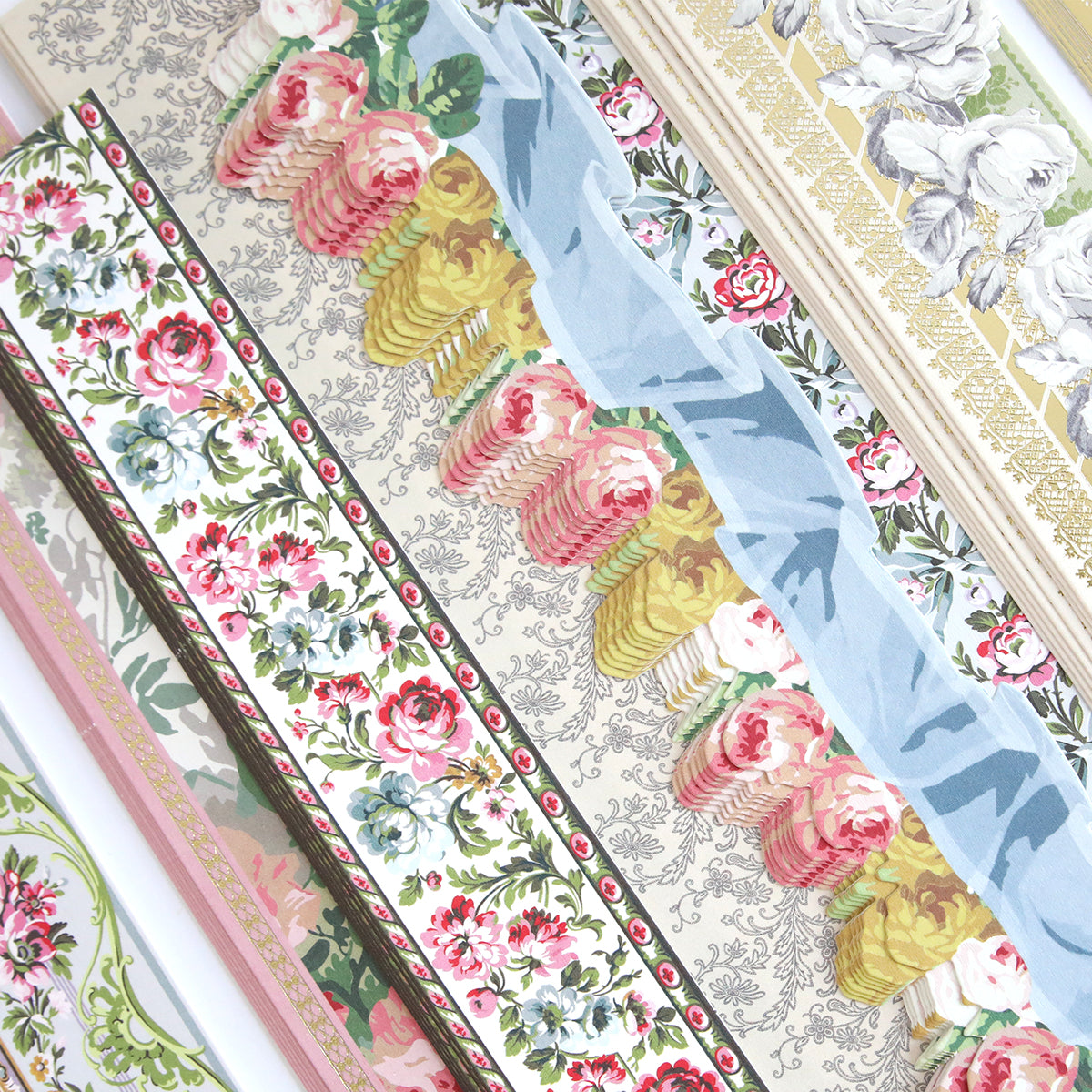 Rows of decorative floral patterned wallpaper samples, arranged diagonally and overlapping, offer perfect inspiration for using Virginia 12" Border Stickers on your next scrapbook pages.