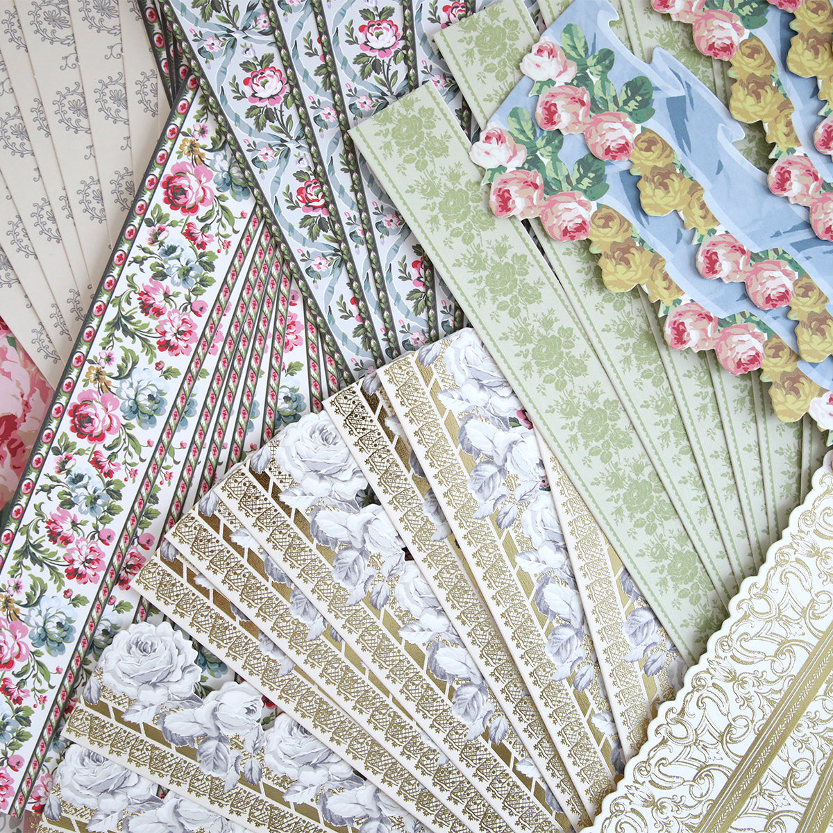 The Virginia 12" Border Stickers feature floral and ornate gold designs, ideal for layering on scrapbook pages or pairing with die cut borders.