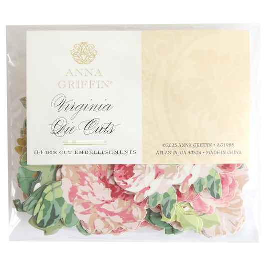 A clear package labeled "Virginia Die Cut Embellishments" contains 84 floral stickers in pink and green patterns, ideal for use as scrapbook embellishments.