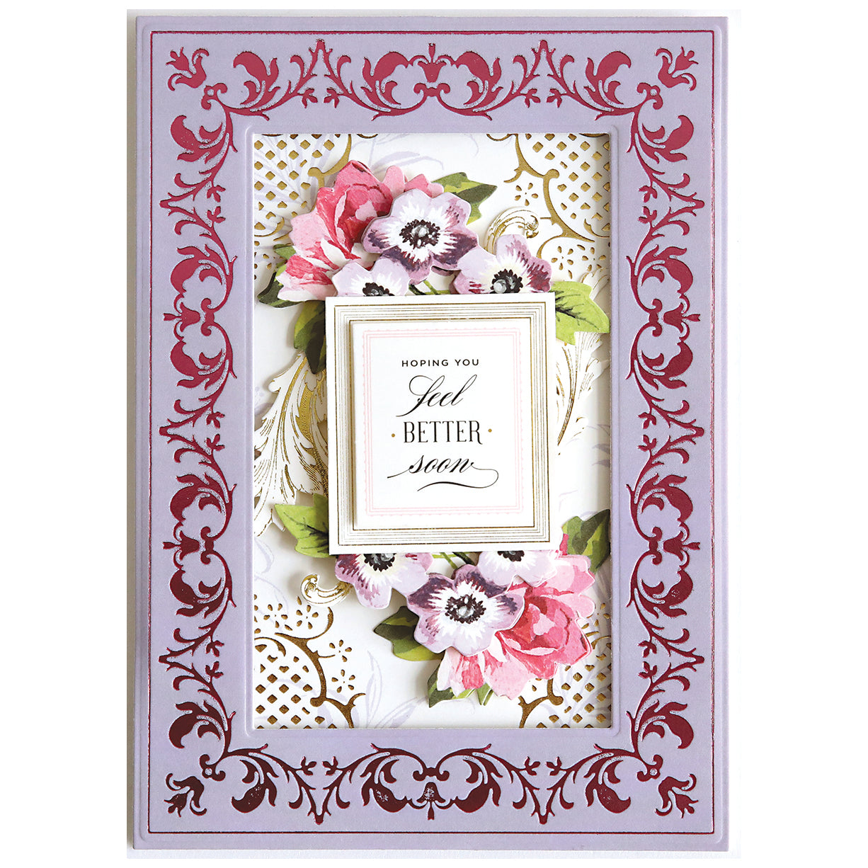 A decorative "Get Well Soon" card featuring pink and white flowers, gold accents from Gilded Fleur Frames Hot Foil Plates, an ornate purple border, and the message: "Hoping you feel better soon.